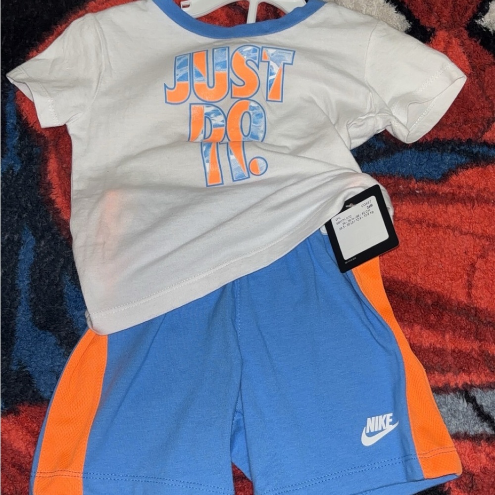 Nike Kids' White and Blue Outfit with Orange Accents